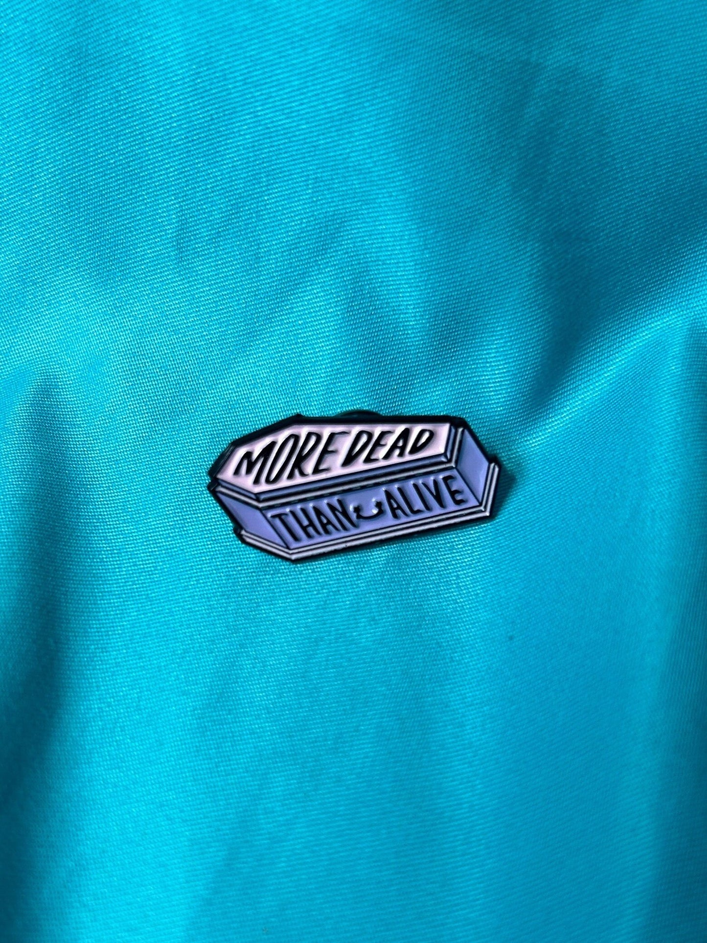 More dead than alive enamel pin coffin spooky black purple and white banner lettering punk aadams family Wednesday