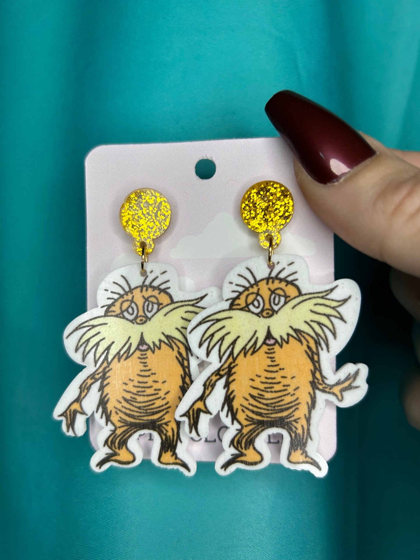 Lorax earrings with bronze glitter circle push back posts in silver dr Seuss