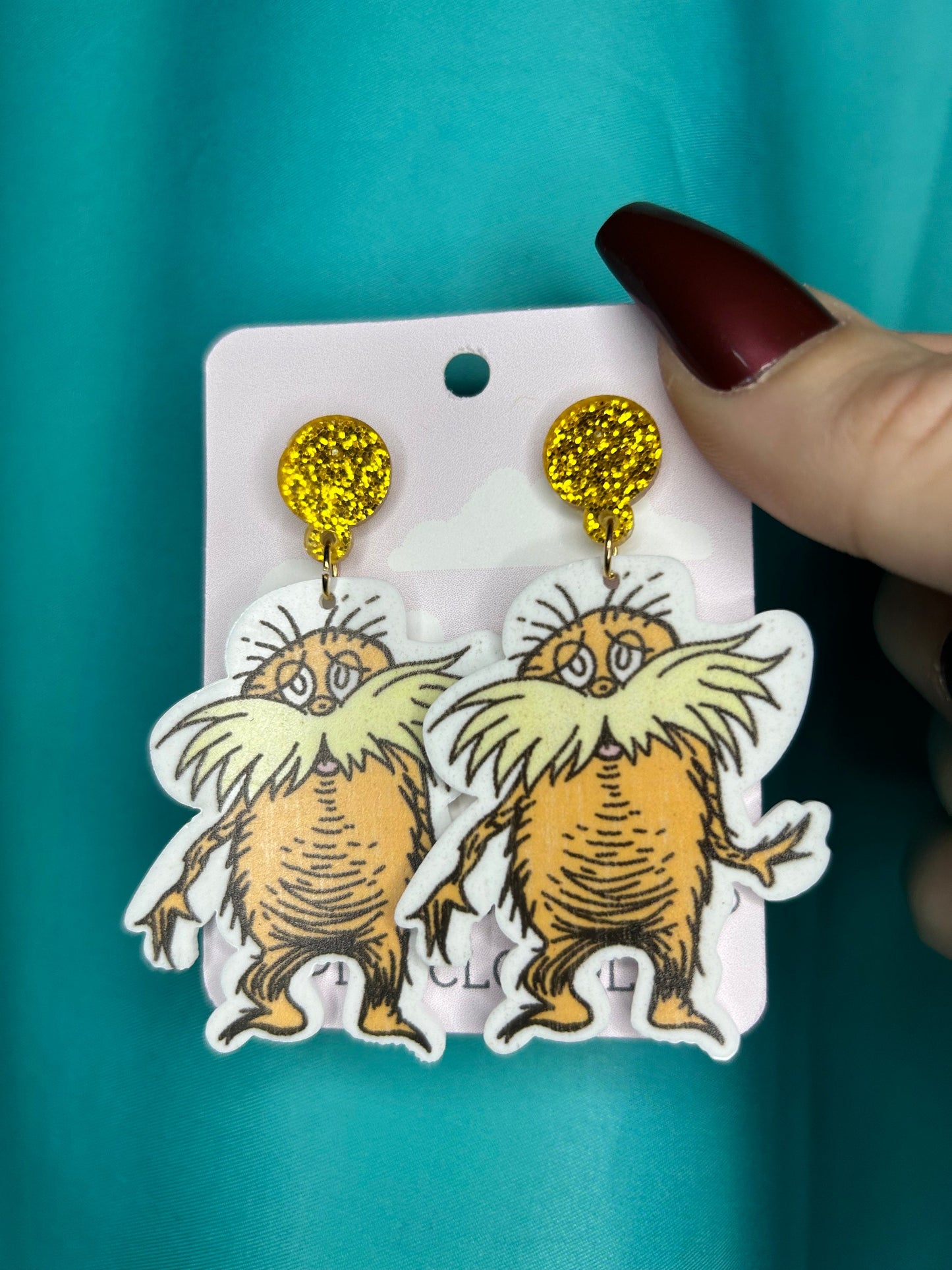 Lorax earrings with bronze glitter circle push back posts in silver dr Seuss