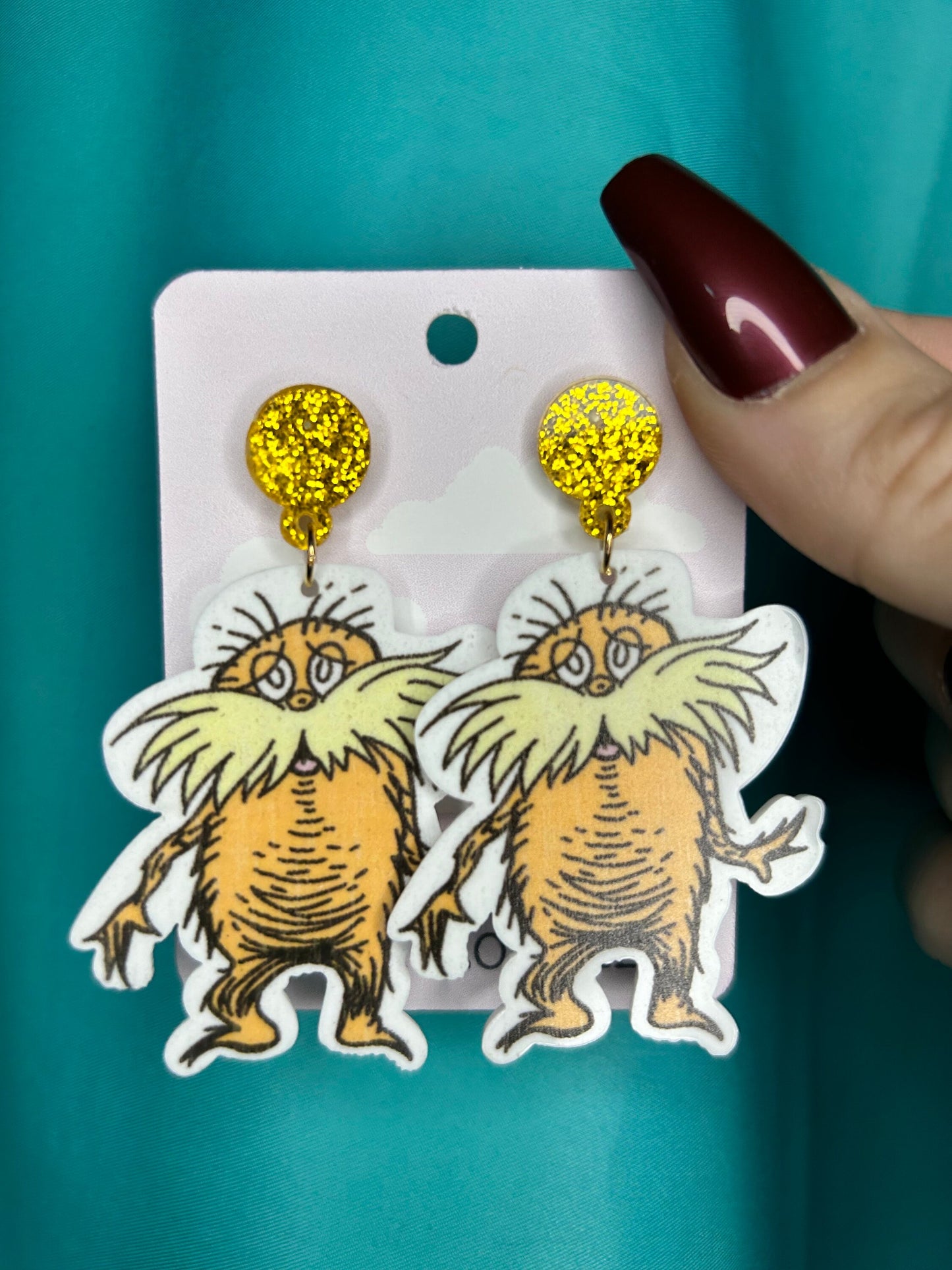 Lorax earrings with bronze glitter circle push back posts in silver dr Seuss